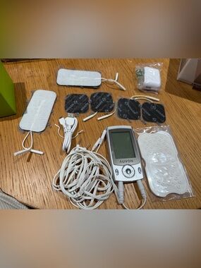 White TENS Unit with Electrode Pads and Cables